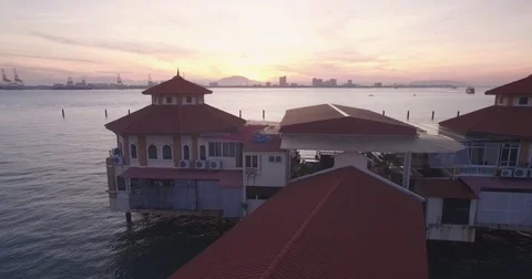Pullback Reveal Drone Shot of Restaurant and Pier in Penang, Malaysia, at Stock Footage 71747950