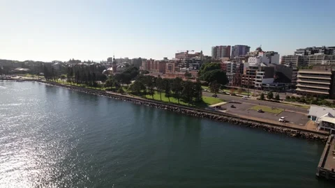 Pullback Reveal Of Ferry Terminal And Fishing Point On Riverside. Hunter River Vídeos de archivo 302958566