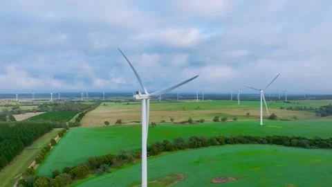Pullback shot of the windfarm turbines Stock Footage 247681689