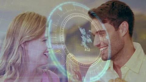 Pullback showing couple with greens and bread smiling holo circle rotating over Stock Footage 333131924