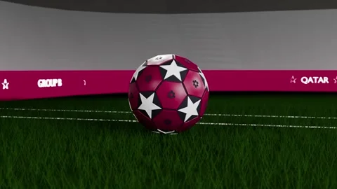Pullback showing rotating maroon starred soccer ball falling onto turf, settling Stock-Footage 333286210