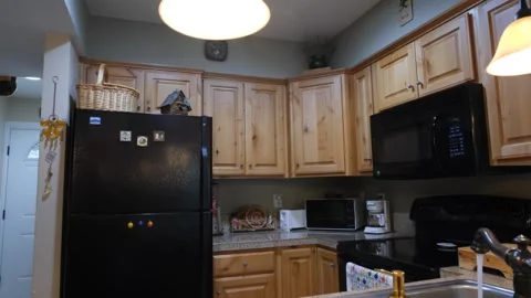 Pullback of a stylish condominium kitchen Stock Footage 135750538
