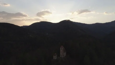 Pullback tilt shot from a small white chapel on an isolated hill with trees, 4k Stock Footage 74496127