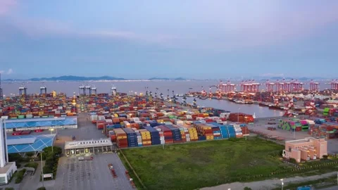 Pullback timelapse over warehouses and container quays at Guangzhou Port Stock Footage 346447473