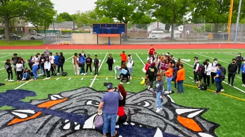 Pullback View of Teenage Students Out on the Football Field Stock-Footage 196242505