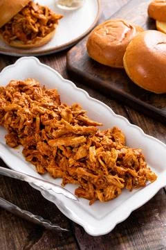 Pulled chicken with bbq sauce ready to make sandwiches Stock Photos