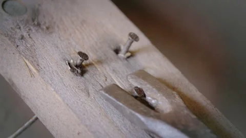 Pulled the old nails out of boards with a claw hammer Video stock 124608115