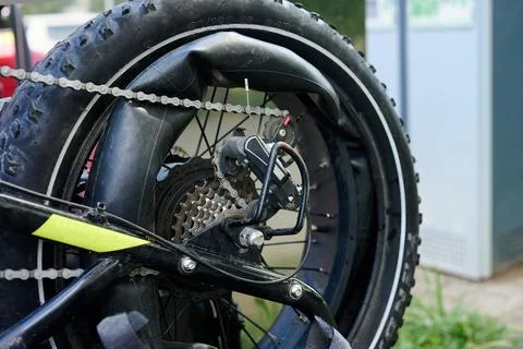 Pulled out inner tube on a flat tire of an electric fat bike Stock Photos