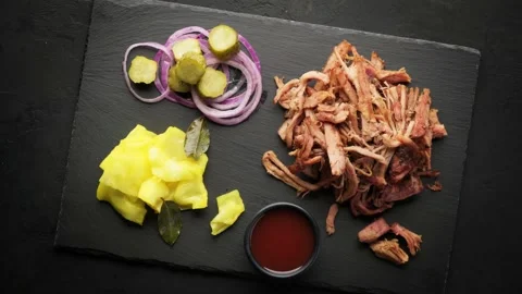 Pulled pork and pickled vegetables, top view, rotation around its axis. Stock Footage 150509303
