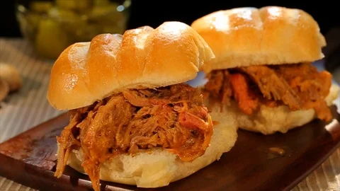 Pulled pork BBQ sandwich. Slow panning shot. CU Stock Footage 102136015