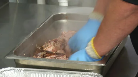 Pulled Pork being prepared in Commercial Restaurant Stock Footage 252097203