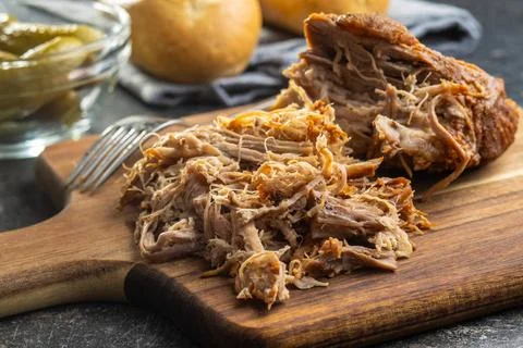 Pulled pork meat. Pulled pork meat on cutting board. Copyright: xZoonar.co... Stock Photos