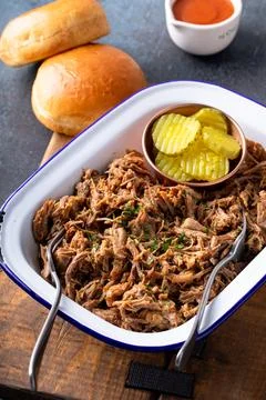 Pulled pork on a serving platter, ready to eat Stock Photos
