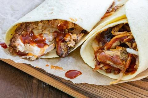 Pulled Pork Wraps with hot BBQ sauce 스톡 사진