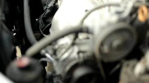 Pulley in car engine spinning rack focus Stock Footage 10579437