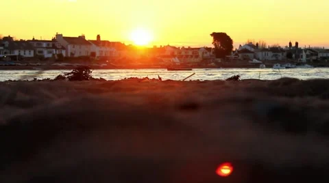Pullfocus from ocean to sand, sunset Stock Footage 48750428
