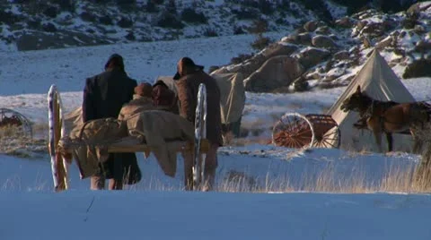Pulling and pushing handcarts over winter prairie Video stock 11365266