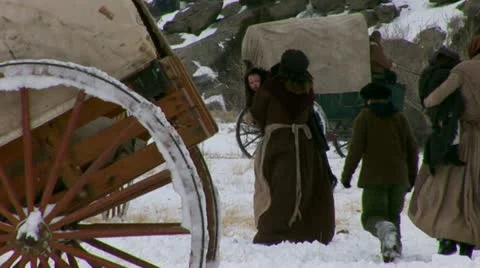 Pulling and pushing handcarts over winter prairie Video stock 11365319