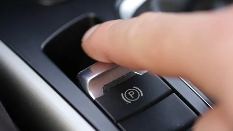 Pulling and releasing electronic handbrake in car Stock Footage 88827926