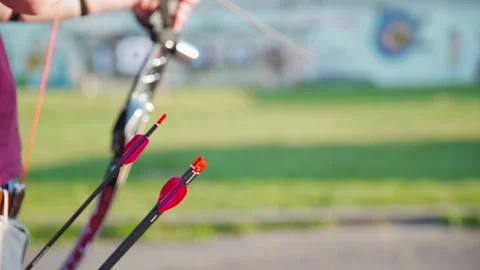 Pulling an arrow out of the holster at archery races Stock Footage 131354430