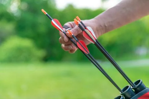 Pulling an arrow out of the holster at archery races. copy space Stock Photos