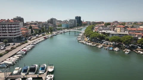 Pulling back drone aerial from Grado town canal and bridge 4K 動画素材 331349310
