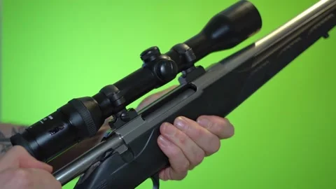 Pulling back end piece and reloading rifle by putting new cartridge into Video stock 151918207