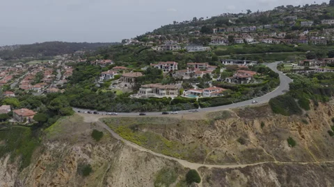 Pulling Back From Large Homes on Palos Verdes Cliff Stock Footage 339710593