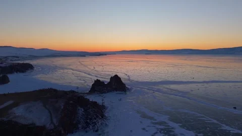Pulling Back Over Shaman Rock and Cracked Ice at Lake Baikal Stock Footage 342235991