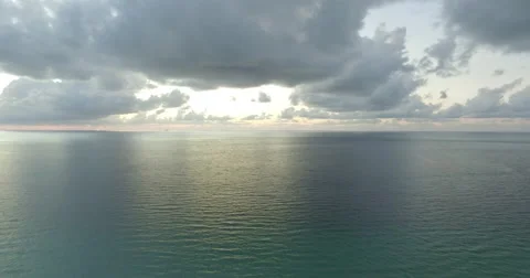 Pulling back from sunrise on Miami Beach Stock Footage 54259907