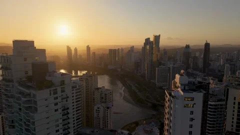 Pulling Back Through Downtown Panama City Skyscrapers at Golden Hour Sunset Video stock 334339768