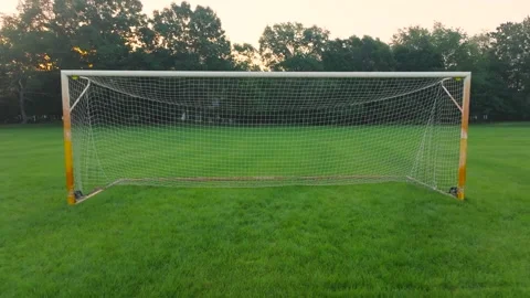 Pulling backward away from soccer net. Stock Footage 245474978