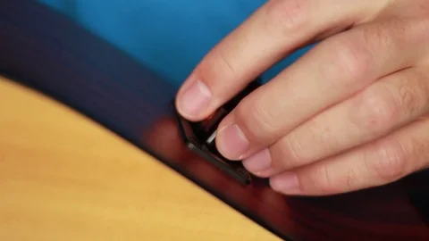 Pulling a battery out from a guitar Stock Footage 71954096