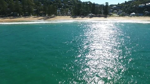 Pulling in to the beach over the water Stock Footage 99755657