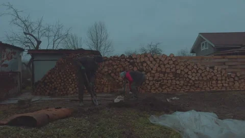 Pulling bricks out of the ground, removing garbage from the ground Stock Footage 322682227