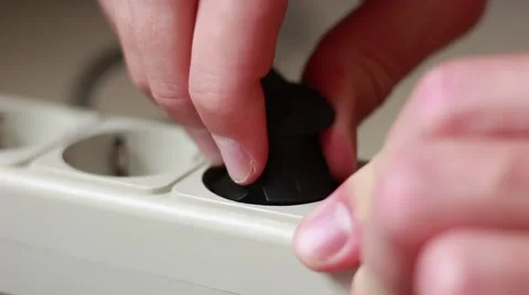 Pulling a cable out from a socket Stock Footage 64622316