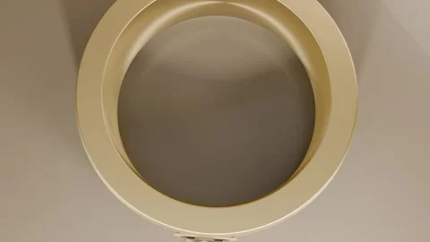 Pulling camera down revealing circular beige recessed ring on pale wall, Stock Footage 339194318