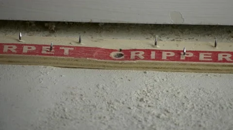 Pulling up carpet gripper with crowbar, 4K Stock Footage 59171234