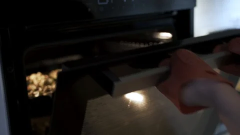 Pulling the casserole out of the oven. Homemade pastries Stock Footage 107086841