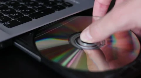 Pulling CD disk out from the disk drive 動画素材 65372747