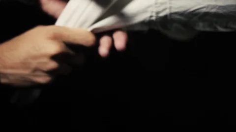 Pulling of cloth by human hands. | Stock Video | Pond5