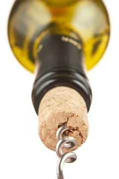 Pulling corkscrew cork from the bottle Stock Photos