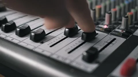Pulling Down Dual Faders on Angled Mixer Stock Footage 318481527