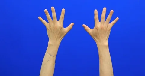 Pulling down something invisible with hands on blue screen background Stock Footage 90276247