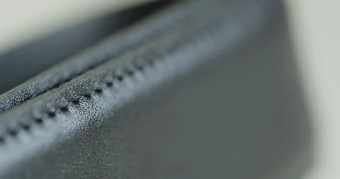 Pulling focus over black leather belt 4K close-up video Stock Footage 262011897