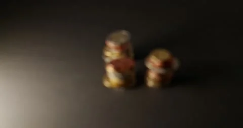 Pulling focus on Stacked Euro Coins on dark Background. Out of focus to focus Stock Footage 147935242