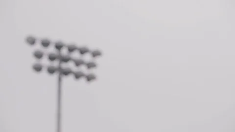 Pulling focus onto stadium lights Stock Footage 103877260