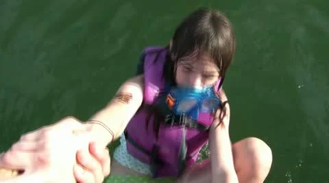 Pulling Girl into Boat 動画素材 12611543