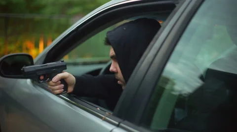 Pulling gun out inside of car threaten Stock Footage 62795856