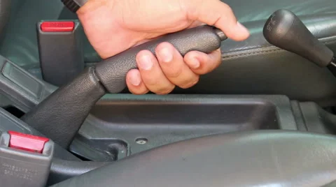 Pulling handbrake of a car Stock Footage 57298150